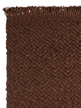 Armadillo Arroyo Rug in Tamarind, corner close-up of the felted wool pile and edge