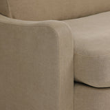 Close-up of Broadway Canvas 100% flax linen upholstery on the Aurelia sectional, showing the natural off-white weave and reversible boxed cushion casing