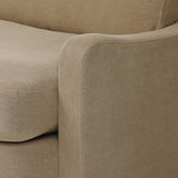 Close-up of Broadway Canvas 100% flax linen upholstery on the Aurelia sectional, showing the natural off-white weave and reversible boxed cushion casing