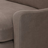 Close-up of Broadway Coffee 100% flax linen upholstery on the Aurelia sectional, showing the deep coffee brown weave and reversible boxed cushion casing
