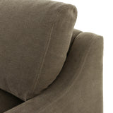 Close-up of Broadway Olive 100% flax linen upholstery on the Aurelia sectional, showing the muted olive green weave and reversible boxed cushion casing