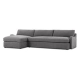 Amber Lewis x Four Hands Aurelia sectional in Broadway Denim linen styled in a living room, left-facing chaise extended across a 128-inch span