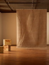 Armadillo Marea Rug in Clay, hand-knotted and hand-carved wool rug shown in a room setting