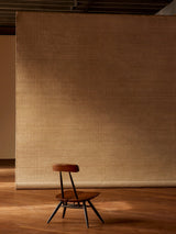 Armadillo Palloza Rug in Rattan, handwoven jute flatweave rug shown in a room setting