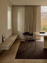 Armadillo Aspen Rug in Peat, handwoven soumak wool rug shown in a room setting