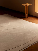 Armadillo Marea Rug in Savon, hand-knotted and hand-carved wool rug shown in a room setting
