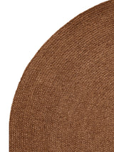 Armadillo Braid Rug in Persimmon, corner close-up of the wool and viscose blend pile and edge