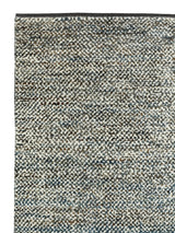 Armadillo Acacia Rug in Galapagos, corner close-up of the wool and abrash-dyed jute pile and edge
