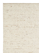 Armadillo Tempest Rug in Tundra, corner close-up of the undyed new zealand wool pile and edge