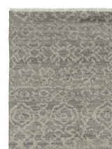 Armadillo Sonata Rug in Plume, corner close-up of the hand-spun afghan wool pile and edge