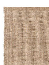 Armadillo Palloza Rug in Rattan, overhead view of the handwoven jute flatweave weave and edge finish