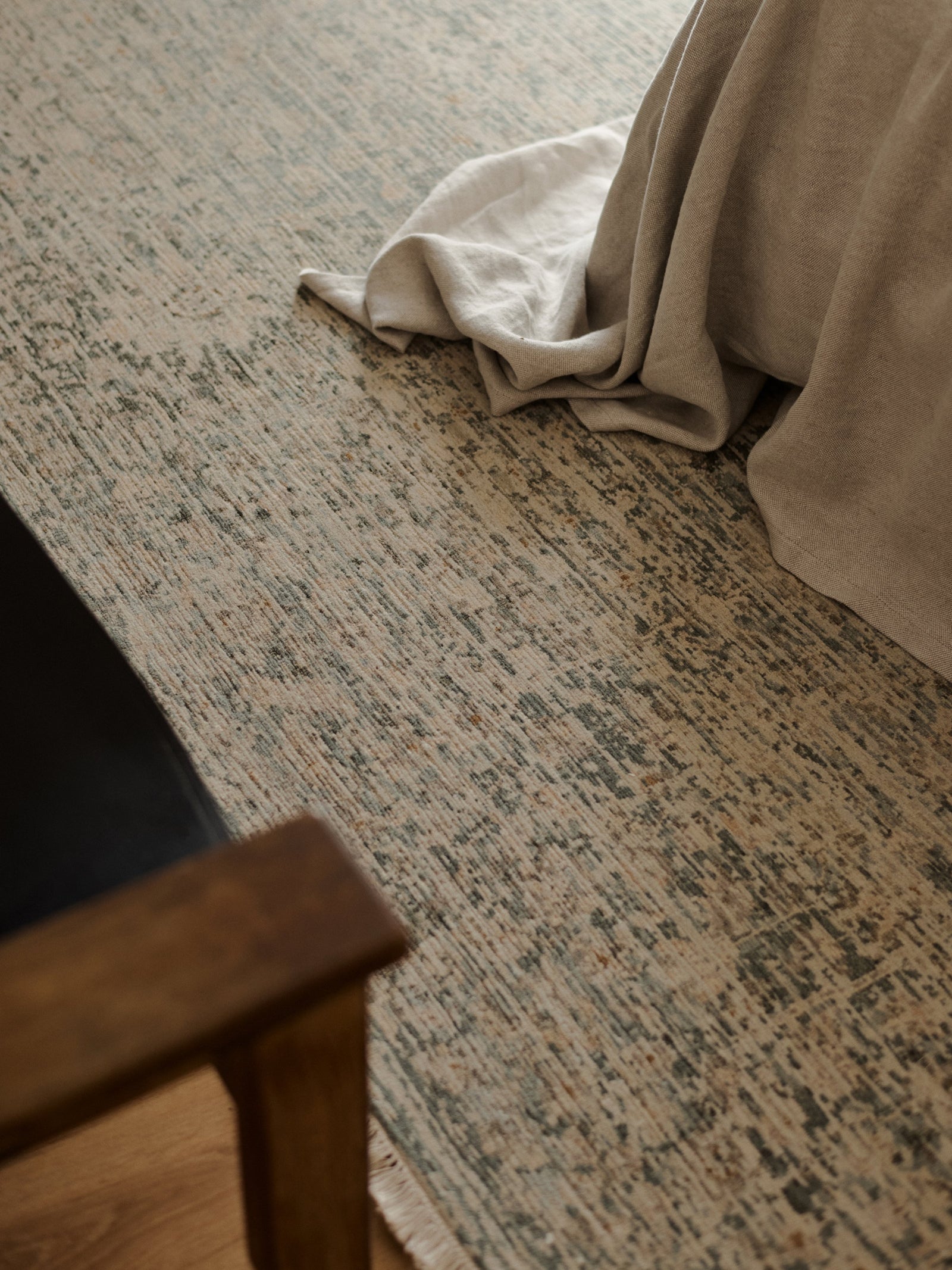 Minuet Rug by Armadillo, hand-knotted clipped wool rug, styled in a room at Calimia Home