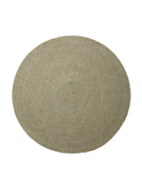 Armadillo Braid Rug in Oregano, a second view of the hand-braided wool blend rug in a styled interior
