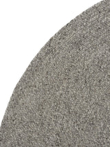 Armadillo Braid Rug in Pumice, corner close-up of the wool and viscose blend pile and edge