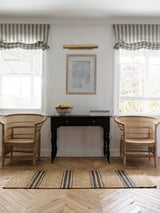 Armadillo River Nook Rug in Natural & Indigo, handwoven jute rug shown in a room setting