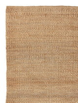 Armadillo Nest Nook Rug in Natural, corner close-up of the jute pile and edge