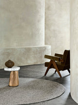 Armadillo Braid Rug in Pumice, hand-braided wool blend rug shown in a room setting