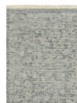 Armadillo Minuet Rug in Skylark, corner close-up of the wool pile and edge