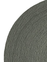Armadillo Nimbus Rug in Oakmoss, corner close-up of the hand-spun new zealand wool with jute stitching pile and edge