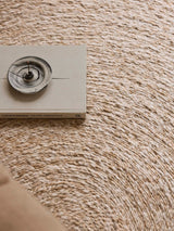 Armadillo Onsen Rug in Papyrus, overhead view of the hand-braided wool and jute weave and edge finish