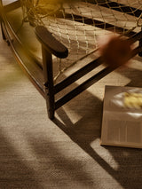 Armadillo Sagrada Rug in Dun, hand-knotted wool cut pile rug shown in a room setting
