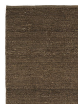 Armadillo Latitude Rug in Caramel, corner close-up of the linen pile and edge