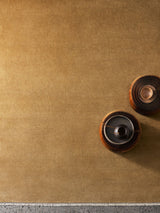 Armadillo Eden Rug in Citrine, a second view of the hand-knotted wool rug in a styled interior