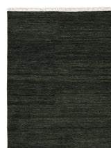 Armadillo Agra Rug in Juniper, corner close-up of the wool pile and edge