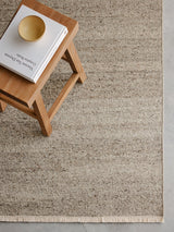 Armadillo Cable Rug in Seed, a second view of the handwoven soumak wool rug in a styled interior
