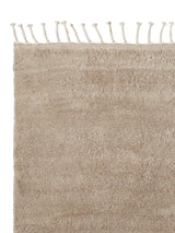 Armadillo Petra Rug in Sparrow, corner close-up of the new zealand wool pile and edge