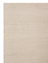 Armadillo Aerie Rug in Coconut, corner close-up of the linen, wool, and jute pile and edge