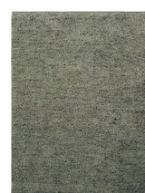 Armadillo Meadow Rug in Seagrass, corner close-up of the wool pile and edge
