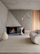Armadillo Cable Rug in Calico, handwoven soumak wool rug shown in a room setting