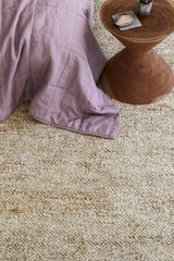 Armadillo Acacia Rug in Fawn, overhead view of the hand-knotted wool and jute weave and edge finish
