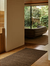 Grange Nook Rug by Armadillo, handwoven wool and jute rug, styled in a room at Calimia Home