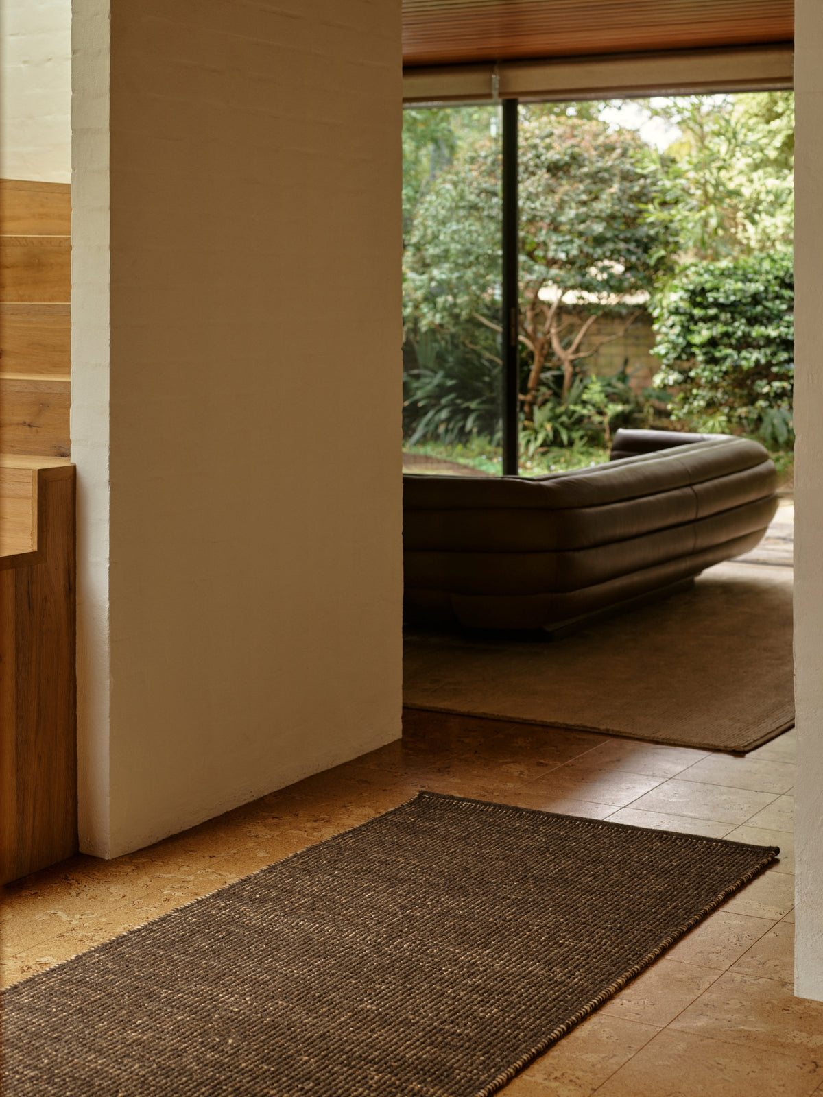 Grange Nook Rug by Armadillo, handwoven wool and jute rug, styled in a room at Calimia Home
