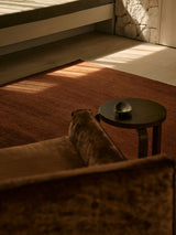 Armadillo Thatch Rug in Copper, a second view of the hand-knotted wool rug in a styled interior