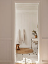 Lucine Nook Rug by Armadillo, hand-braided jute rug, styled in a room at Calimia Home