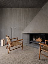 Armadillo Pebble Rug in Whippet, handwoven boucle wool rug shown in a room setting