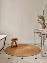 Armadillo Lucine Nook Rug in Natural, a second view of the hand-braided jute rug in a styled interior