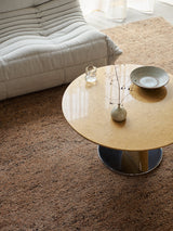 Armadillo Meadow Rug in Tamarillo, a second view of the hand-knotted wool rug in a styled interior