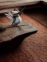 Armadillo Mason Rug in Sangria, a second view of the handwoven new zealand wool rug in a styled interior