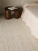 Armadillo Palermo Rug in Bone, a second view of the hand-knotted linen rug in a styled interior