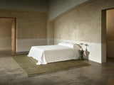 Armadillo Mojave Rug in Laurel, hand-knotted jute rug shown in a room setting