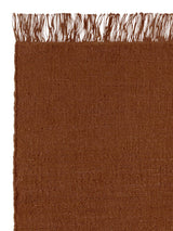 Armadillo Willow Rug in Henna, corner close-up of the linen, wool, and jute pile and edge