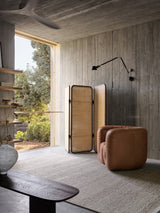 Armadillo Cable Rug in Seed, handwoven soumak wool rug shown in a room setting
