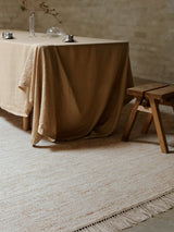 Armadillo Willow Rug in Eggshell, a second view of the handwoven flatweave rug in a styled interior
