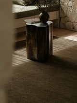 Armadillo Thatch Rug in Gumnut, hand-knotted wool rug shown in a room setting