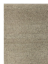 Armadillo Pebble Rug in Gravel, corner close-up of the hand-spun new zealand wool pile and edge