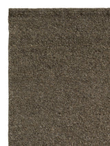 Armadillo Aspen Rug in Hawthorn, corner close-up of the undyed wool pile and edge